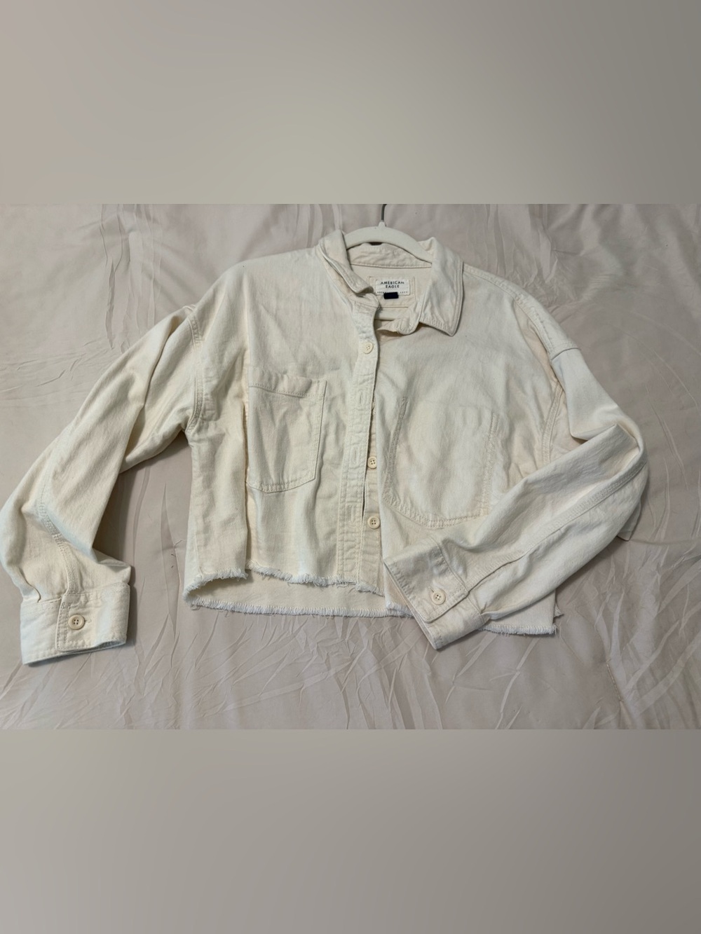 American Eagle Outfitters Cream Cropped Jean Jacket